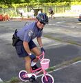 Policeman on pink bike.jpg