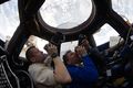 ISS-27 Dmitri Kondratyev and Paolo Nespoli photograph the Earth through the Cupola.jpg