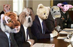 George Bush meets with his cabinet to work on a plan to spread freedom and love throughout the land.